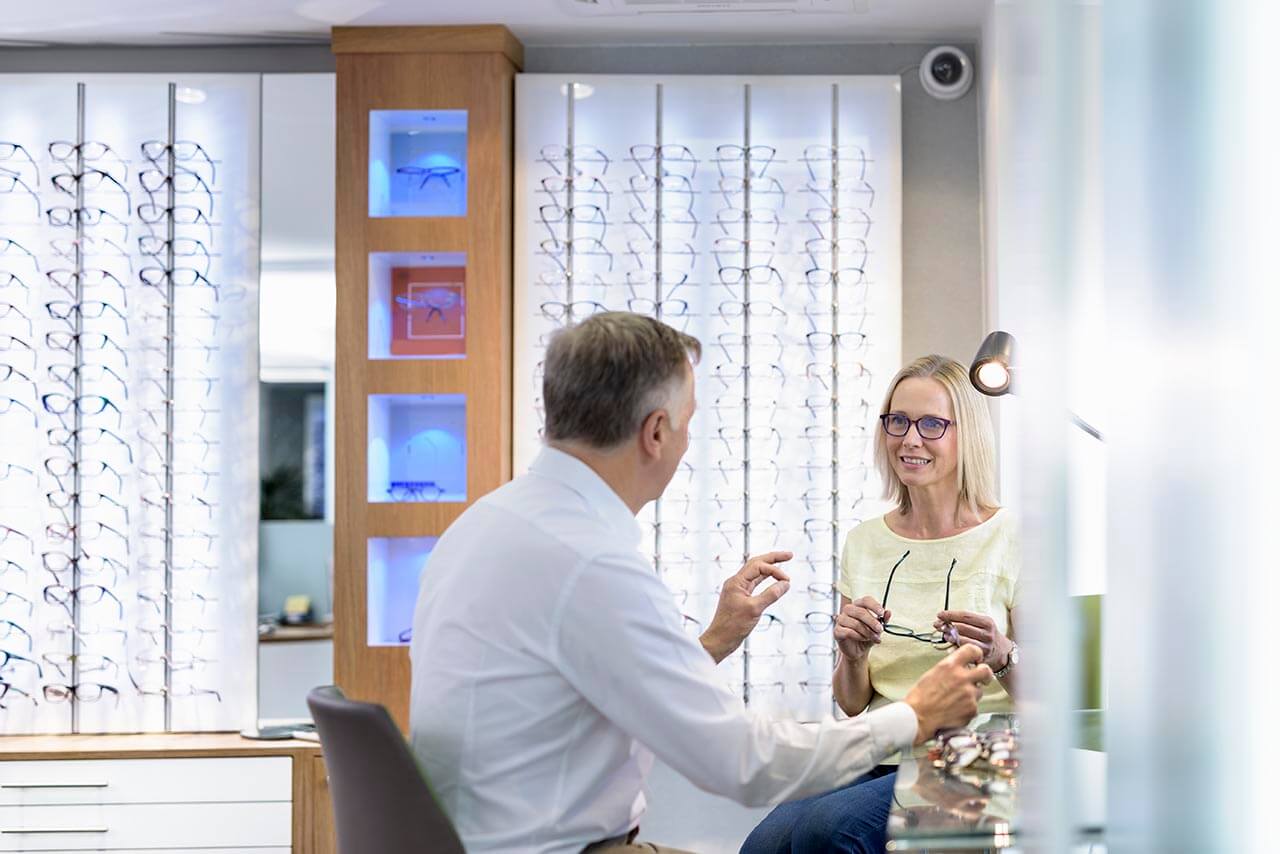 Optician with a customer